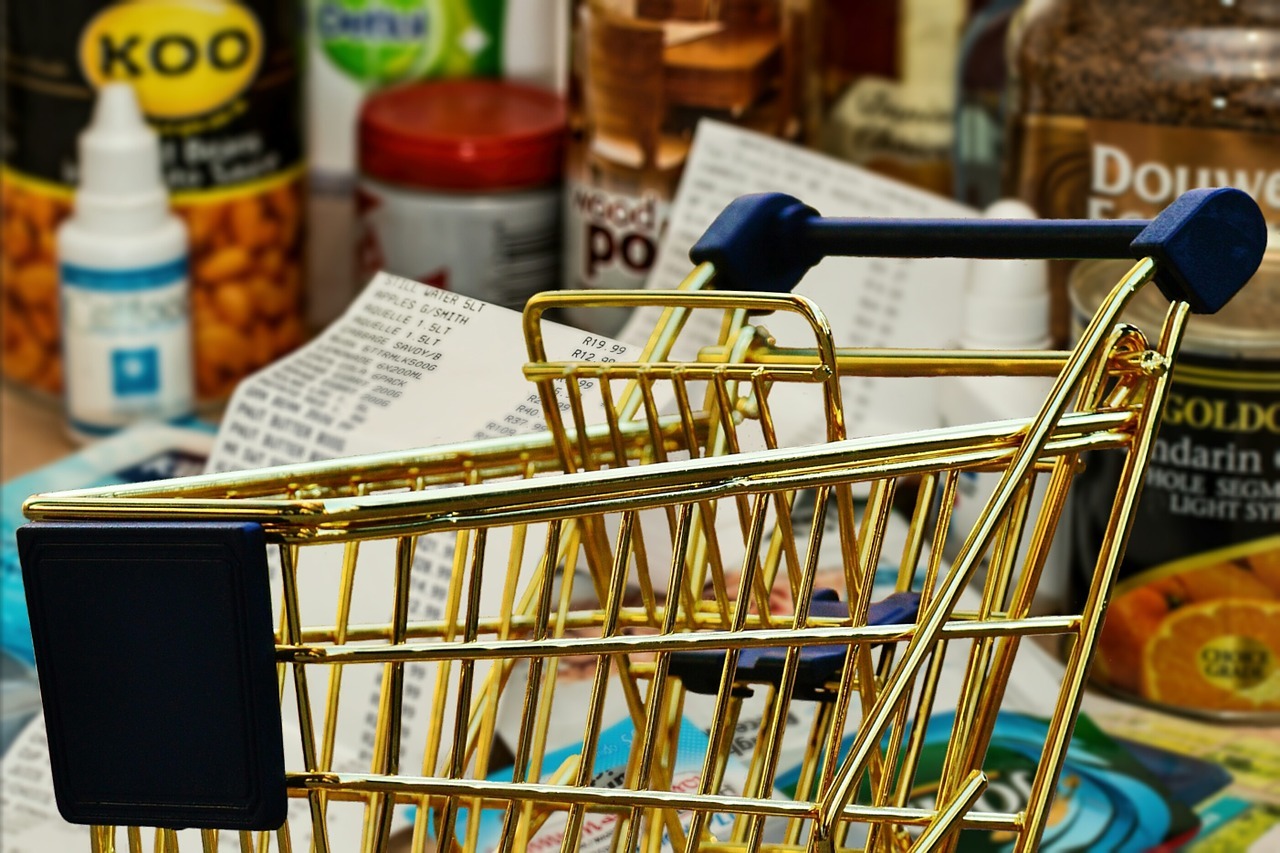 A shopping trolley with some shopping items.